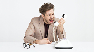 man yelling into phone